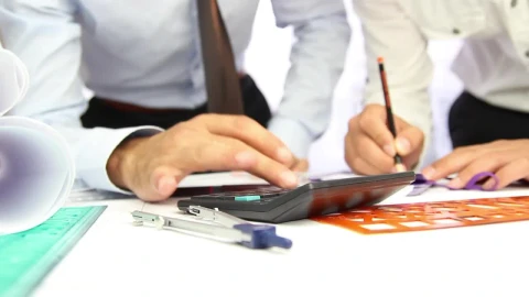 Stock Video Architects Working With A Calculator In A Desk Live Wallpaper For PC – Free Live Wallpaper