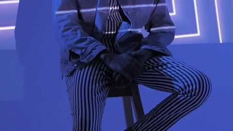 Stock Video A Hipster Sitting On A Chair Under Lights Live Wallpaper For PC animated wallpaper preview