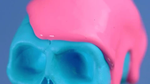 Stock Video Blue Plastic Skull Covered With A Pink Liquid On A Live Wallpaper For PC - On Wallpaper