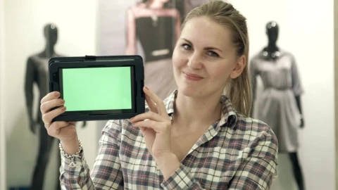 Stock Video Blonde Woman Showing A Tablet With A Green Screen Live Wallpaper For PC - Live Wallpaper
