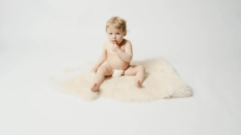Stock Video Blonde Baby In Diaper Sits On Furry Rug Live Wallpaper For PC - On Wallpaper