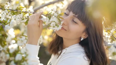 Stock Video Black Haired Woman Smelling White Flowers Live Wallpaper For PC - Live Wallpaper