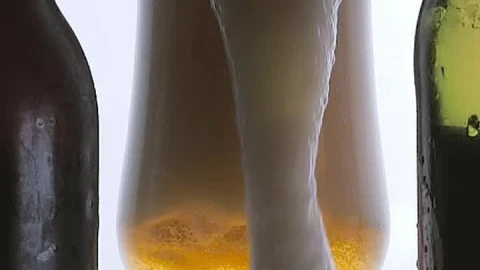 Stock Video Beer Foam Spilling Into A Glass On White Background Live Wallpaper For PC - Live Wallpaper