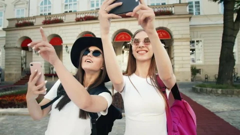 Stock Video Beautiful Tourists Pose For Social Media In European Town Live Wallpaper For PC - Live Wallpaper