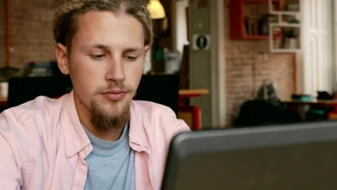 Stock Video Bearded Man Working On His Laptop From Home Live Wallpaper For PC - Live Wallpaper