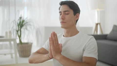 Video Stock Closeup Of Man In Namaste Yoga Pose In Living Room Live Wallpaper For PC - Birds of prey Wallpaper