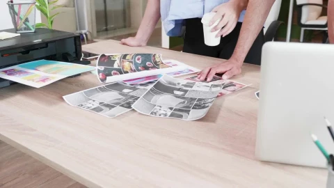 Video Stock Closeup Of Creatives Looking Through Ideas On Desk Live Wallpaper For PC - Birds of prey Wallpaper