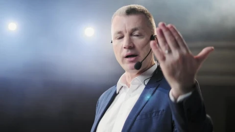 Video Stock Closeup Of Conference Speaker On Stage Gesturing At Camera Live Wallpaper For PC - Birds of prey Wallpaper
