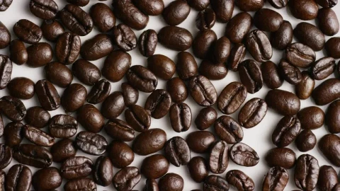 Stock Video Coffee Beans Rotating On White Surface Live Wallpaper For PC - Live desktop wallpaper Wallpaper
