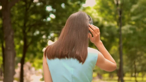 Stock Video Girl Walking In Nature With Music On Her Headphones Live Wallpaper For PC - Live Wallpaper
