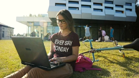 Stock Video Girl Types On Laptop Outside University Building Live Wallpaper For PC - Live Wallpaper