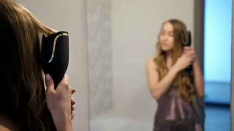 Stock Video Girl Curling Her Hair In Front Of A Mirror Live Wallpaper For PC - Live Wallpaper