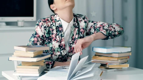 Stock Video Girl Bows Her Head Exhausted From Studying Live Wallpaper For PC - Live Wallpaper