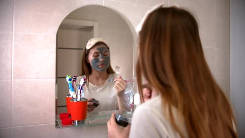 Stock Video Girl Applying A Mask In Front Of A Mirror Live Wallpaper For PC - Live Wallpaper