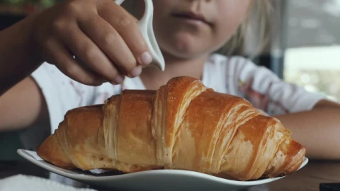 Stock Video Girl Adding Sweet Milk On A Croissant Live Wallpaper For PC - Live Wallpaper