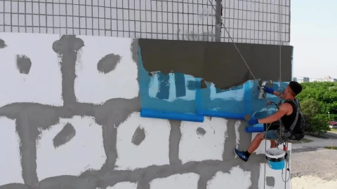 Stock Video Industrial Climber Putting Cement To A Wall Animated Wallpaper - Animated Wallpaper