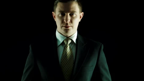 Stock Video Man In A Suit Put Money On His Mouth Animated Wallpaper - Live desktop wallpaper Wallpaper
