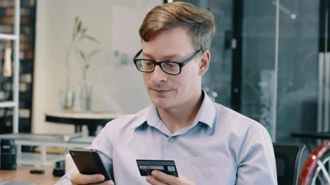 Stock Video Man Entering His Credit Card Details On A Cell Phone Animated Wallpaper - Live desktop wallpaper Wallpaper