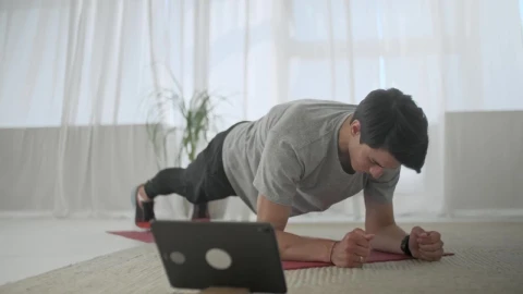 Stock Video Man Doing Plank Exercise In His Living Room Animated Wallpaper - Live desktop wallpaper Wallpaper
