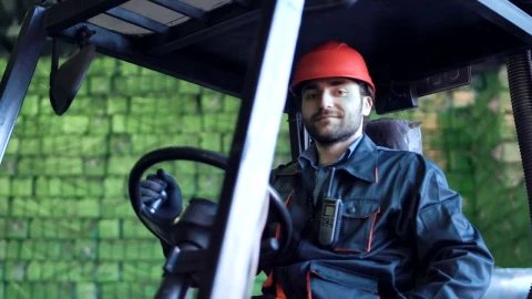 Stock Video Loading Vehicle Operator Smiling To The Camera Animated Wallpaper animated wallpaper preview