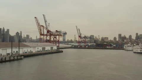 Stock Video Loader Cranes In The Port Seen From The River Animated Wallpaper - In Wallpaper