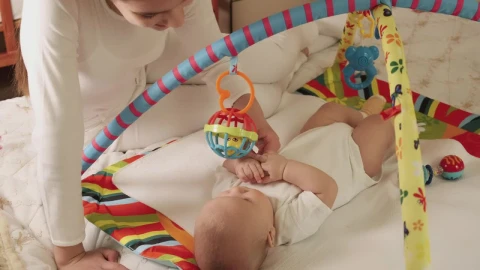 Stock Video Little Sister Plays With Her Baby Brother Animated Wallpaper animated wallpaper preview