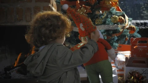 Stock Video Little Girl Taking A Gift From The Christmas Tree Animated Wallpaper animated wallpaper preview