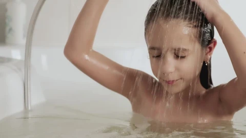 Stock Video Little Girl Rinsing Out The Shampoo From Her Hair In Animated Wallpaper - In Wallpaper