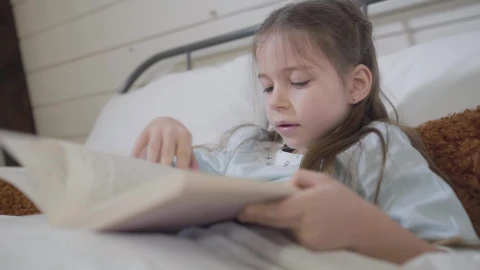 Stock Video Little Girl Reads A Story In A Book Animated Wallpaper - In Wallpaper