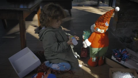 Stock Video Little Girl Playing With Gifts On Christmas Morning Animated Wallpaper animated wallpaper preview