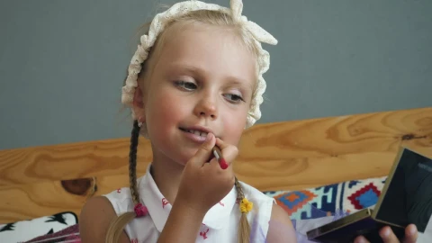 Stock Video Little Girl Painting Her Lips Animated Wallpaper animated wallpaper preview