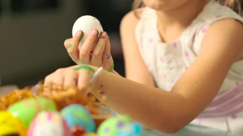 Stock Video Little Girl Painting Easter Eggs Animated Wallpaper animated wallpaper preview