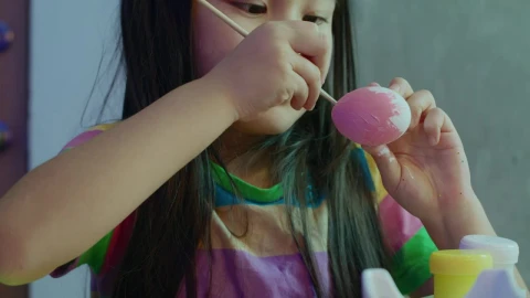 Stock Video Little Girl Painting Easter Eggs 42854 Animated Wallpaper animated wallpaper preview