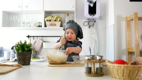 Stock Video Little Girl Making Cookie Mixture In The Kitchen Animated Wallpaper - In Wallpaper