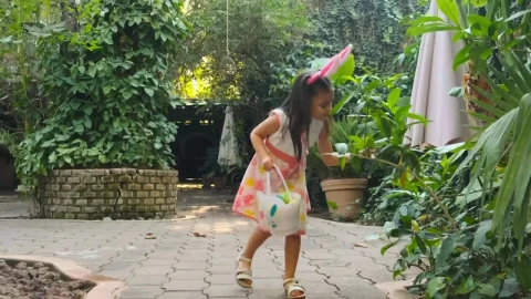 Stock Video Little Girl Collecting Easter Eggs Animated Wallpaper animated wallpaper preview