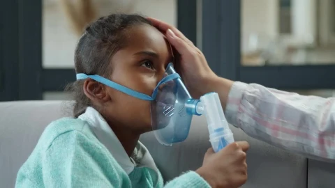 Stock Video Little Girl Breathing From A Nebulizer Animated Wallpaper animated wallpaper preview