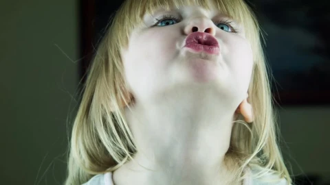 Stock Video Little Cute Girl Kissing To The Camera Animated Wallpaper animated wallpaper preview