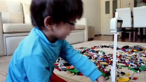 Stock Video Little Boy Playing With Many Lego Cubes Animated Wallpaper animated wallpaper preview