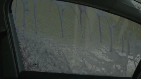 Stock Video Little Boy Is Cleaning A Window Car Animated Wallpaper animated wallpaper preview