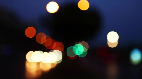 Stock Video Light Particles Reflected In A Traffic Bokeh Animated Wallpaper - In Wallpaper