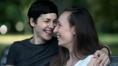 Stock Video Lgtbq Women Kiss And Talk On Park Bench Animated Wallpaper animated wallpaper preview