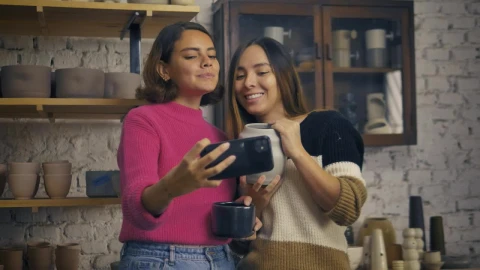 Stock Video Lgbtq Girlfriends Taking A Selfie In A Pottery Shop Animated Wallpaper - In Wallpaper