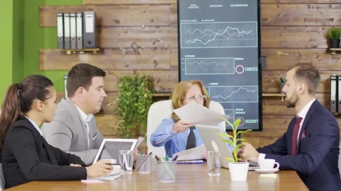 Stock Video Leader Presents Business Plan To Team At Meeting Animated Wallpaper animated wallpaper preview