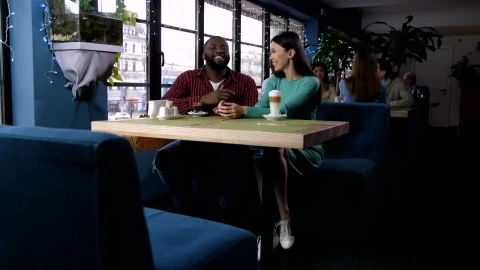 Stock Video Laughing Couple In A Coffee Shop Animated Wallpaper - In Wallpaper