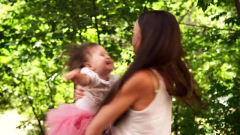Stock Video Mother Spinning Her Child In The Garde Animated Wallpaper - In Wallpaper