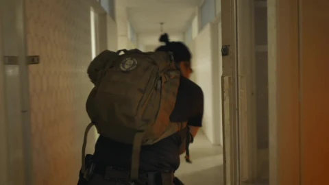 Stock Video Mercenary Looking For Zombies In An Abandoned Buildin Animated Wallpaper - In Wallpaper