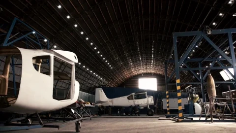 Stock Video Man Walking In An Aircraft Hanga Animated Wallpaper - In Wallpaper