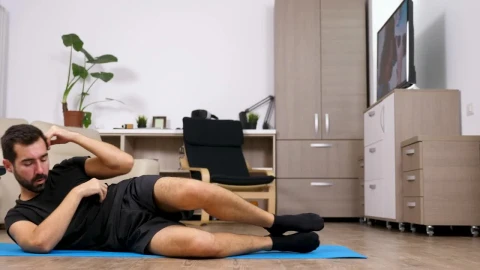 Stock Video Motivated Man Exercises On Floor At Home Live Wallpaper - Live Wallpaper