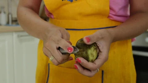 Stock Video Peeling Potatoes In The Kitchen For Dinner Live Wallpaper – Free Live Wallpaper
