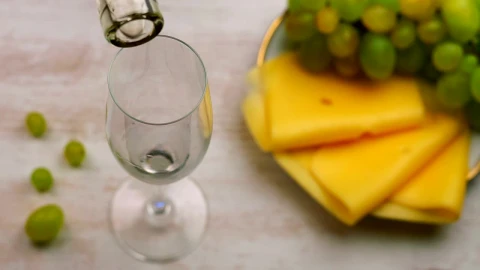 Video Stock Pouring White Wine And A Plate Of Cheese Snacks Live Wallpaper Free - A Wallpaper